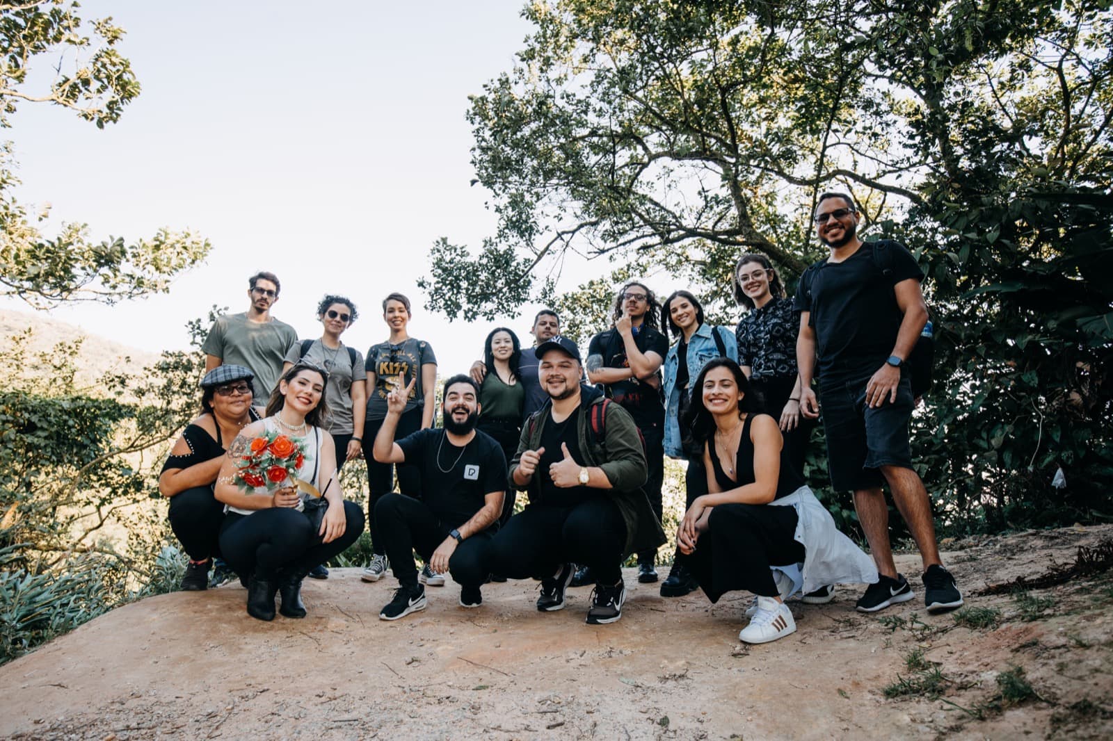 Friends at the edge of a pine forest, ready to hike