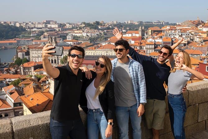 Porto Adventure: Bookshop Discovery, Scenic River Cruise, and Cable Car Challenge